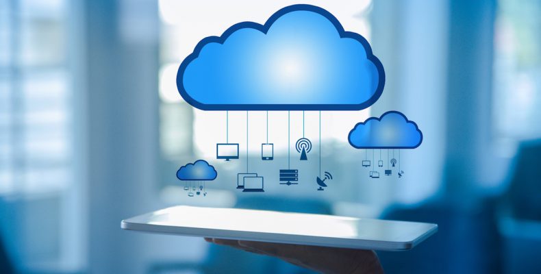 Illustration of cloud hovering over a hand holding a tablet. little icons, such at a satellite, computer, and server hang from the cloud like a mobile.